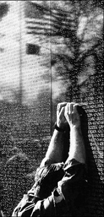 A soldier weeps at the Vietnam War Memorial